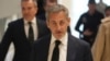 Former French President Nicolas Sarkozy arrives as he goes on trial over alleged illegal financing of his 2007 presidential campaign by the government of late Libyan leader Moammar Gadhafi, Jan. 6, 2025 in Paris. 