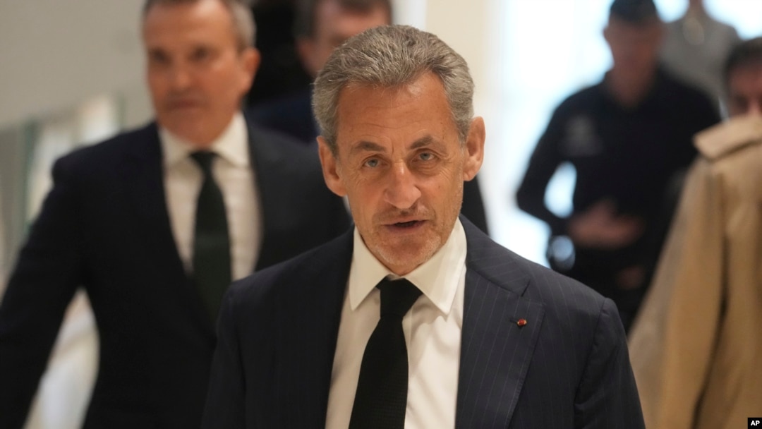 Former French President Nicolas Sarkozy arrives as he goes on trial over alleged illegal financing of his 2007 presidential campaign by the government of late Libyan leader Moammar Gadhafi, Jan. 6, 2025 in Paris. 