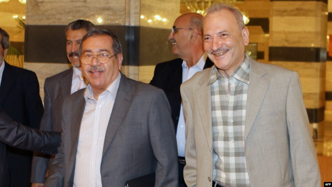 FILE - A delegation of the main Syrian opposition arrives to meet with the UN-Arab League envoy to Syria Lakhdar Brahimi.
