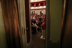 Audience members wait for the Tehran Symphony Orchestra during a break at Unity Hall, in Tehran, Iran, July 3, 2019.