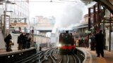 A steam train enters Farringdon underground station in London. The train, an 1898-built steam engine known as Met Locomotive No 1, pulled carriages along part of the Hammersmith &amp; City Line, as part of the celebrations to mark 150th anniversary of the world&#39;s oldest underground passenger railway.