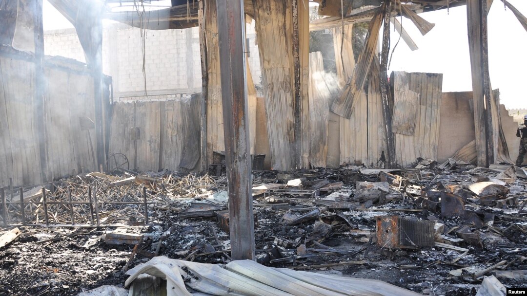 Debris from damaged buildings after gunmen stormed the headquarters of Al-Ikhbariya news channel near Damascus, June 27, 2012, in this handout photograph released by Syria's national news agency SANA.