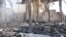 Debris from damaged buildings after gunmen stormed the headquarters of Al-Ikhbariya news channel near Damascus, June 27, 2012, in this handout photograph released by Syria's national news agency SANA.