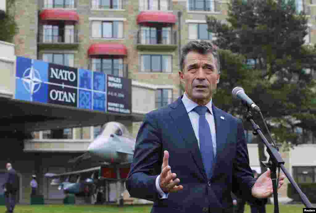 NATO Secretary-General Anders Fogh Rasmussen speaks to the media at the Celtic Manor resort, near Newport, in Wales, Sept. 4, 2014.