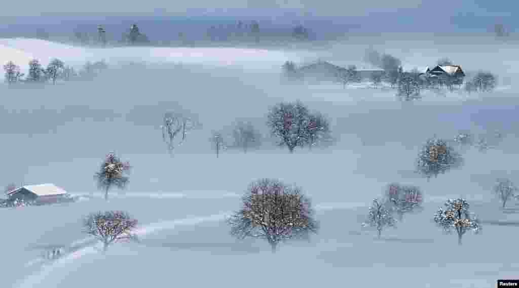 A snow-covered landscape is seen near Menzingen, Switzerland.