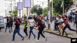 FILE - Protesters disperse as police deploy in Maputo, Mozambique, Nov. 7, 2024. Protesters dispute the outcome of Oct. 9 elections, which saw the ruling Frelimo party extend its 49-year rule.