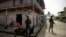 FILE - Panamanian border police patrol a street in Puerto Obaldia near the Colombian border in Panama, Sept. 16, 2015.