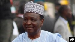 FILE- In this Sunday, May. 29, 2011 file photo Former Nigerian Presidents, Ernest Shonekon, left, Gen Abdulsalam Abubukar, centre, Gen Yakubu Gowon, third left arrived for the inauguration ceremony of former Nigeria President Goodluck Jonathan at the eagl