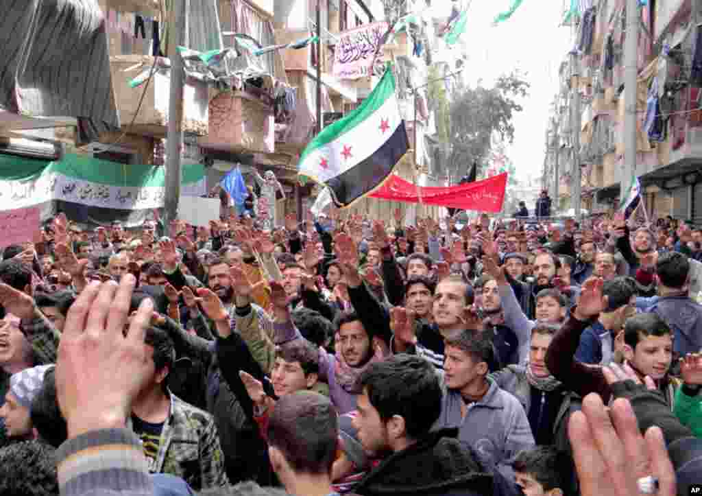 This citizen journalism image provided by Aleppo Media Center, AMC, shows anti-Syrian regime protesters in Bustan Al-Qasr, Aleppo, Syria, March 8, 2013.