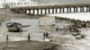 A fishing boat remains stranded after strong waves hit in Lobitos, Talara Province, Peru, Dec. 27, 2024.