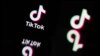 (FILES) This photograph taken in Mulhouse, eastern France on October 19, 2023, shows the logo of the social media video sharing app Tik Tok reflected in mirrors.