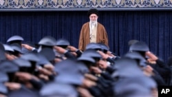 Iranian Supreme Leader Ayatollah Ali Khamenei listens to the national anthem as air force officers salute during their meeting in Tehran on Feb. 7, 2025. (Office of the Iranian Supreme Leader via AP)