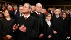 Members of the Supreme Court gather in the House of Representatives Chamber last year for President Barack Obama's final State of the Union Address.