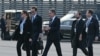 US Secretary of State Antony Blinken (C) walks across the tarmac to board Air Force One at Berlin-Brandenburg Airport (BER) in Schoenefeld, southeast of the German capital, on October 18, 2024, at the end of the visit to Germany.