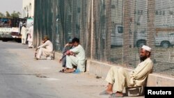 Saudi authorities say "cover-up" firms perpetuate unemployment for many, such as these laborers in Riyadh, June 18, 2013.