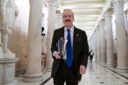 FILE - House Foreign Affairs Committee Chair Eliot Engel, D-N.Y., walks through the Hall of Columns at the Capitol as House Democratic chairs gather for a meeting with Majority Leader Steny Hoyer, D-Md., in Washington, March 27, 2019.