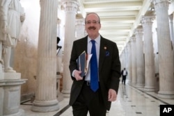 House Foreign Affairs Committee Chair Eliot Engel, D-N.Y., walks through the Hall of Columns at the Capitol as House Democratic chairs gather for a meeting, March 27, 2019.
