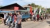 FIDemonstrators from the Dawei Technological University along with others march to protest against the military coup, in Dawei, Myanmar April 9, 2021 in this still image from a video. (Courtesy Dawei Watch/via Reuters) 