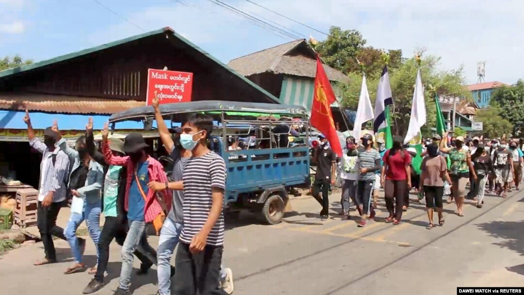 FIDemonstrators from the Dawei Technological University along with others march to protest against the military coup, in Dawei, Myanmar April 9, 2021 in this still image from a video. (Courtesy Dawei Watch/via Reuters) 