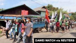 FIDemonstrators from the Dawei Technological University along with others march to protest against the military coup, in Dawei, Myanmar April 9, 2021 in this still image from a video. (Courtesy Dawei Watch/via Reuters) 