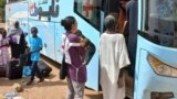 FILE: A worker from International Committee of the Red Cross (ICRC) carries children during the evacuation of children and caretakers from the Mygoma Orphanage in khartoum, in Wad Madani, Sudan, in this handout image released on June 7, 2023. ICRC/Handout via REUTERS