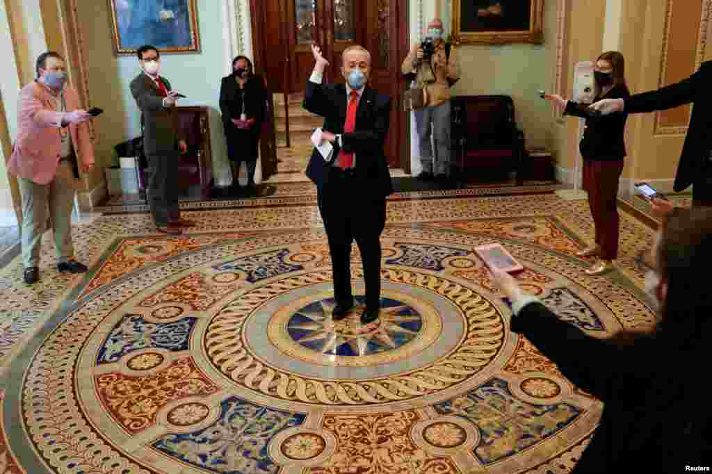 U.S. Senate Minority Leader Chuck Schumer (D-NY) talks to reporters inside the U.S. Capitol as senators return to work amid concerns their legislative sessions could put lawmakers and staff at risk of contracting the coronavirus, in Washington.