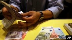 A man counting money.