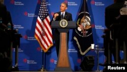 President Barack Obama answers questions while at the quarterly meeting of the Business Roundtable in Washington, Dec. 3, 2014. 