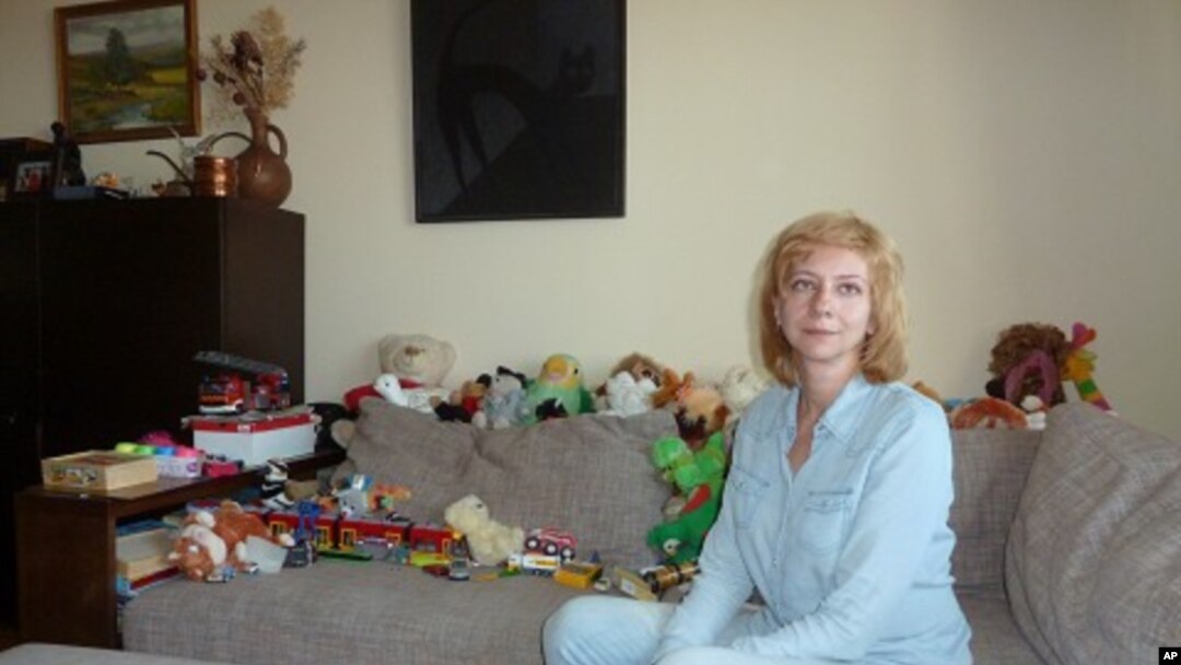 Irina Khalip, dissident Belarussian journalist, describes in interview in her Minsk apartment her family's ordeal at the hands of Belarus' KGB. Her husband, the runner-up in last December's presidential elections, is serving a five year jail sentence, she