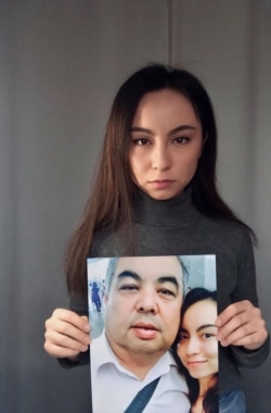 Exiled Uighur Samira Imin holds a picture of her father, Iminjan Seydin, who went missing in China’s Xinjiang province in 2017. (Photo curtesy of Samira Imin).