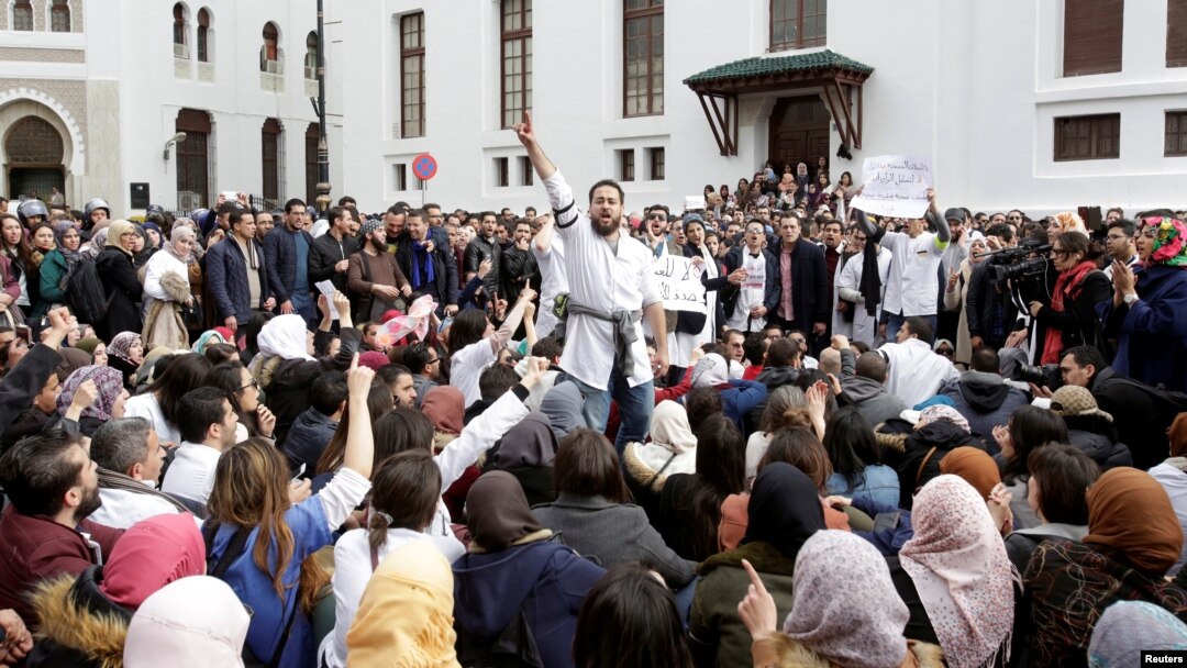 FILE - Algerian doctors, who are completing their residency stage of their studies, hold a sit-in protest in Algiers , Feb. 12, 2018. 