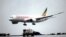 FILE - An Ethiopian Airlines Dreamliner Boeing 787 lands at Bole International airport in Addis Ababa, Ethiopia. 