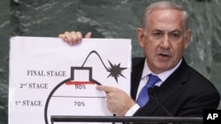 Israel's Prime Minister Benjamin Netanyahu points to a red line he drew on the graphic of a bomb used to represent Iran's nuclear program as he addresses the 67th United Nations General Assembly at the U.N. Headquarters in New York, September 27, 2012.