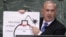 Israel's Prime Minister Benjamin Netanyahu points to a red line he drew on the graphic of a bomb used to represent Iran's nuclear program as he addresses the 67th United Nations General Assembly at the U.N. Headquarters in New York, Sept. 27, 2012.