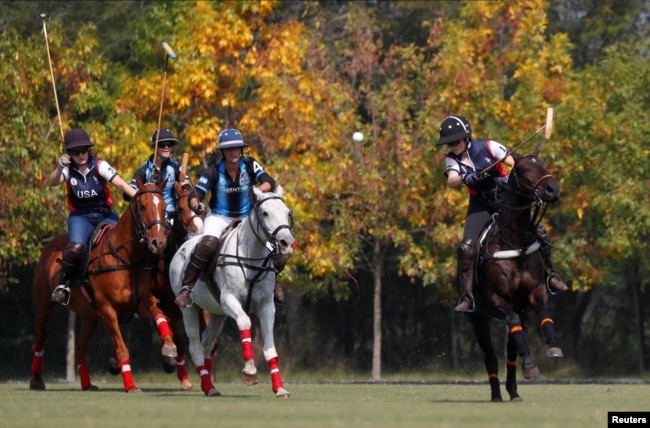 Members of women's polo teams from Argentina and the United States practice before the Women's Polo World Championship, in Pilar, on the outskirts of Buenos Aires, Argentina April 8, 2022. (REUTERS/Agustin Marcarian)