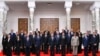 In this photo provided by Egypt's presidency media office, Egyptian President Abdel-Fattah el-Sissi, center, poses with Egypt's new cabinet, led by Prime Minister Mostafa Madbouly, at Al-Ittihadiya Palace in Cairo, Egypt, July 3, 2024.