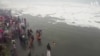 Drone Shows Hindu Devotees Taking Dip in Toxic River Foam