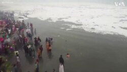 Drone Shows Hindu Devotees Taking Dip in Toxic River Foam