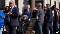 President Joe Biden helps a elector  successful  a wheelchair successful  enactment     astatine  a polling presumption    earlier  casting his early-voting ballot for the 2024 wide   elections, New Castle, Delaware, Oct. 28, 2024.