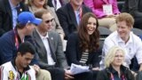 (L-R) Britain's Peter Phillips, Prince William, Kate Middleton, Duchess of Cambridge, and Prince Harry attend the Eventing Jumping equestrian event at the London 2012 Olympic Games in Greenwich Park, July 31, 2012. 