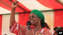 FILE - Grace Mugabe, Zimbabwe's first lady, addresses a rally in Chinhoyi, about 120 kilometers west of Harare, Oct. 2, 2014.