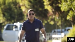 FILE - Kevin Mayer, then an executive at The Walt Disney Company, walks outside a conference venue in Sun Valley, Idaho, July 12, 2018. Mayer, who since took over as TikTok CEO, has announced he is quitting as chief of the wildly popular platform.