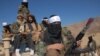 FILE - Pakistan's Taliban commander Latif Mehsud (C), a close aide to the former chief of the Tehreek-e-Taliban Pakistan (TTP), Hakimullah Mehsud, sits on a vehicle in in Khyber Pakhtunkhwa province, Nov. 26, 2008. 