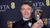 Peter Straughan poses with the adapted screenplay award for 'Conclave' at the 78th British Academy Film Awards, BAFTA's, in London, Feb. 16, 2025. (Photo by Joel C Ryan/Invision/AP)