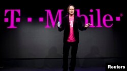 T-Mobile CEO John Legere speaks during a news conference at the 2014 International Consumer Electronics Show in Las Vegas, Nevada, January 8, 2014.