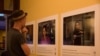 Audiences look at photos of victims from the abuse of domestic workers in an exhibition &ldquo;No one should work this way&rdquo; at Foreign Correspondent of Phnom Penh on May 7th 2015. (Nov Povleakhena/VOA Khmer)