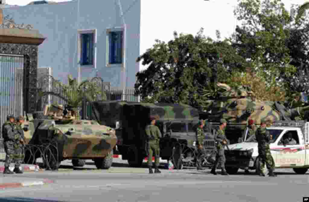 Soldiers guards the parliament building in Tunis, Saturday, Jan. 15, 2011.