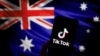 The logo of Chinese-owned video app TikTok is seen on a smartphone in front of an image of the Australian national flag in this illustration picture taken April 4, 2023. 