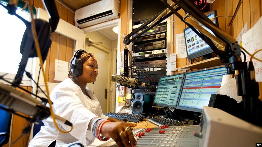 FILE - Radio Miraya host Lubna Lasu broadcasts the Betna Weekend Edition program in the southern Sudanese city of Juba, April 10, 2010. 
