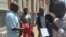 Zimbabwe journalists outside the Constitutional Court after it struck off defamation in the southern African country, Feb. 3, 2016. (Sebastian Mhofu/VOA)